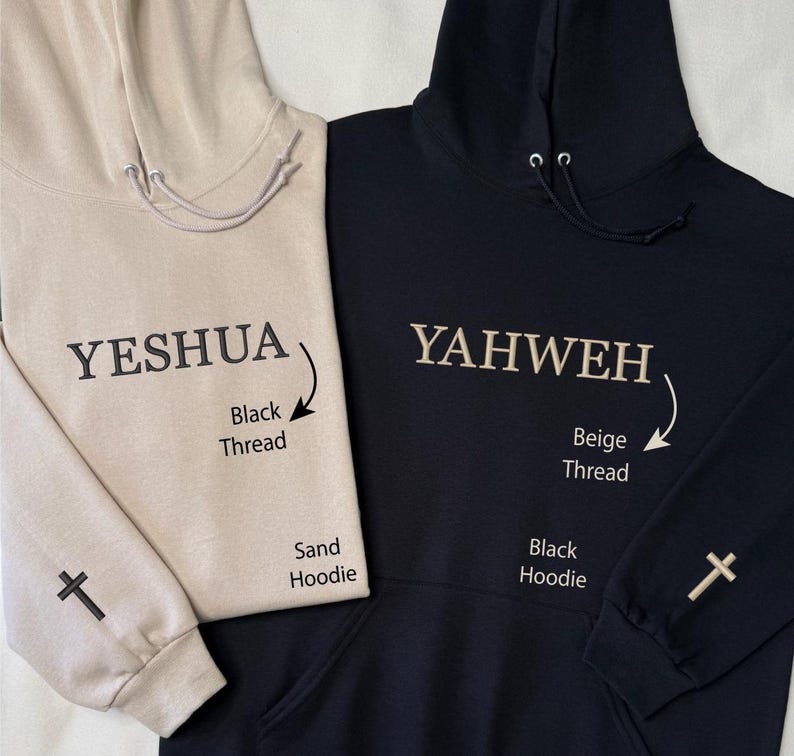 May include: Two hooded sweatshirts, one sand-colored and one black. The sand hoodie has "YESHUA" embroidered in black thread, with a cross on the sleeve. The black hoodie features "YAHWEH" in beige thread, also with a cross on the sleeve.