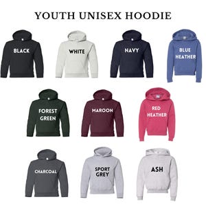 May include: A display of youth unisex hoodies in various colors, including black, white, navy, and blue heather. Other colors are forest green, maroon, red heather, charcoal, sport grey, and ash. Each hoodie has a hood and a front pocket.
