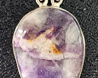 May include: A silver pendant with a purple fluorite stone and a small purple amethyst accent stone. The fluorite stone has a unique marbled pattern.