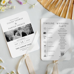 May include: Two white wedding fan cards with rounded edges. One has a black and white photo and wedding details. The other lists the wedding timeline and party details. Both have cream ribbon handles.
