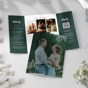 May include: A tri-fold wedding invitation with a dark green border. The invitation includes details, a photo collage, and a reply section with a QR code. The center panel reads "Save The Date" with photos of a couple. The invitation is on a white surface.