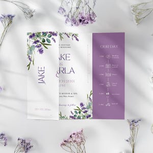 May include: A tri-fold wedding invitation with a lavender and green floral design. The invitation includes the names "Jake & Carla", the wedding date, time, and location, and a schedule for the day. The background is white.
