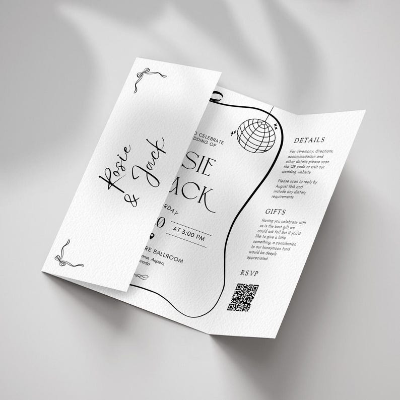 May include: A white wedding invitation with black text and decorative line art. The invitation is folded and features the names "Rosie & Jack", event details, and a QR code for RSVP.