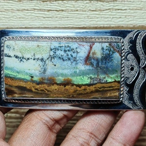 Rare petrified wood buckle head with scenic motif
