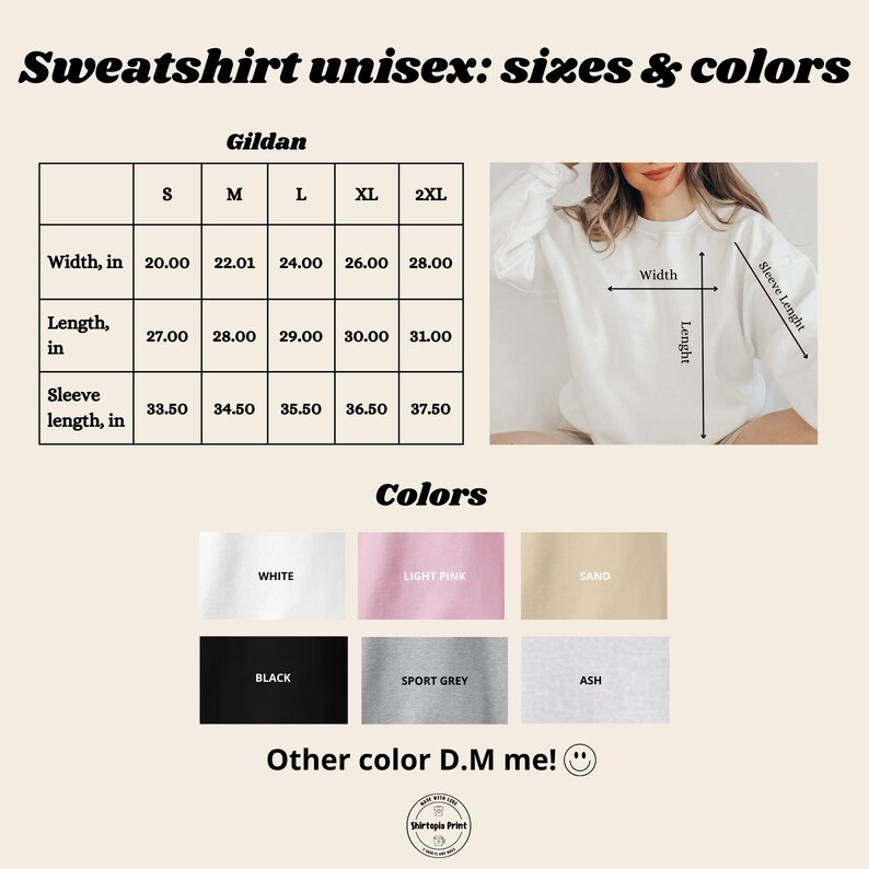 Op de afbeelding: Afbeelding van een witte Gildan sweatshirt met maat- en kleuropties. De maattabel geeft de breedte, lengte en mouwlengte in inches weer voor de maten S tot 2XL. Kleuropties zijn wit, lichtroze, zand, zwart, sportgrijs en as.