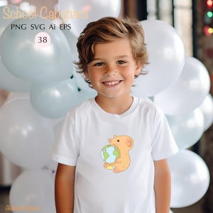 May include: A white t-shirt featuring a cartoon capybara holding a globe. The capybara is light orange with a yellow belly. The text "School Capybara" is at the top of the image. The image also includes the text "PNG SVG AI EPS" and the number "38".