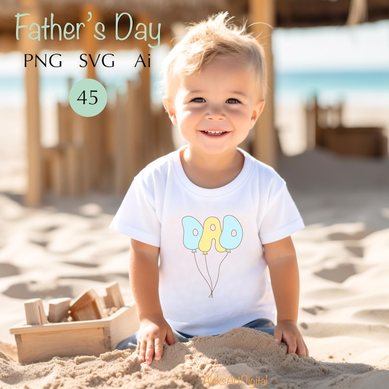 May include: A young child wearing a white t-shirt with the word "DAD" written on balloons. The image includes the text "Father's Day" and other file type indicators. The child is sitting on the sand at the beach.