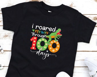 Rugí a través de la camiseta de 100 días, la camisa de la escuela T-Rex, la camisa del día 100 de la escuela, la camisa del jardín de infantes, la camisa de regreso a la escuela, la camiseta de regalo del maestro