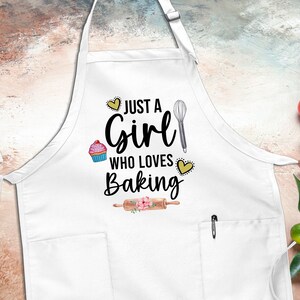 May include: White apron with a pocket and the text "Just a Girl Who Loves Baking" with a cupcake, whisk, and rolling pin graphic.