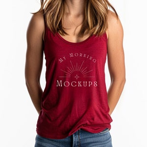 May include: A red tank top with a white graphic that says "My Morning Mockups" with a sunburst design.