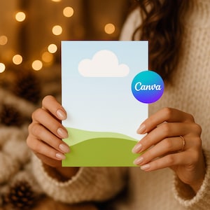 Puede incluir: Una tarjeta rectangular con un diseño de cielo y nubes, colinas verdes y el logotipo de Canva. La tarjeta está sostenida por una persona. El logotipo de Canva es un círculo azul y morado con la palabra "Canva" en blanco.