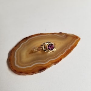 14kt yellow gold ring with purple sapphire