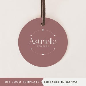 May include: A pink circle tag with a white logo that says "Astrieille Jewelry" with a star design around the text.