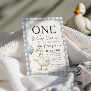 May include: A birthday invitation with a whimsical design. The invitation features a cartoon goose holding a balloon, with the text "ONE Silly Goose" and event details. The background is a light blue gingham pattern.