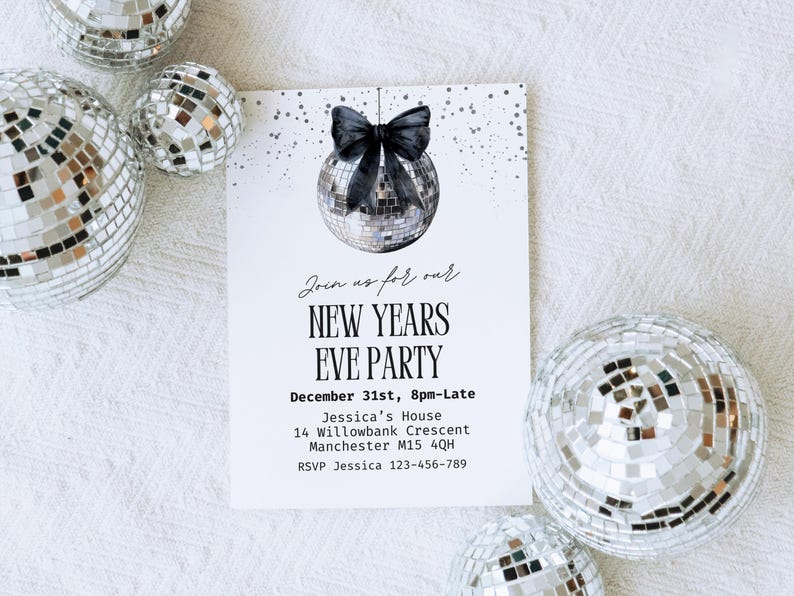 May include: A New Year's Eve party invitation with a disco ball illustration and a black bow. The invitation includes the event details: date, time, location, and RSVP information. Several disco balls surround the invitation.