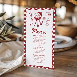 May include: A vertical menu card with a red and white scalloped border. The top features red line drawings of a grill, tongs, a burger, a pacifier, and a baby bottle. The text reads Menu, BBQ Favorites, Sides, and Sweet Treats with listed items.