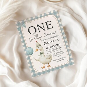 May include: A birthday invitation with a light blue gingham border and a cartoon goose holding a balloon. The invitation reads "ONE Silly Goose" and includes event details: "Oscar's 1st Birthday, August 26 at 1PM."