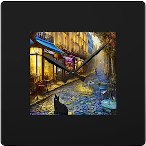 May include: A black clock with a Parisian street scene featuring cobblestone streets, cafes, and a black cat. The clock hands are black and the clock face is white.