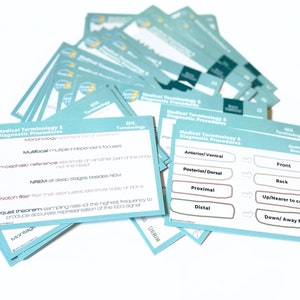 May include: A set of blue and white flashcards with the title "Medical Terminology & Diagnostic Procedures". The cards contain definitions of medical terms and procedures, such as "multifocal", "non-cephalic reference", "NREM", "notch filter", and "Nyquist theorem".