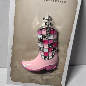 May include: Pink and white checkered cowboy boot charm with rhinestones. The charm is attached to a silver loop and has the text "poetic spirit by bead treasures" on the card.