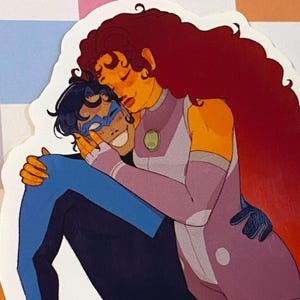 May include: A sticker featuring two cartoon characters embracing. One character has blue and black attire with a mask, the other has orange skin, long red hair, and a purple and white outfit. The background is a colorful checkered pattern.