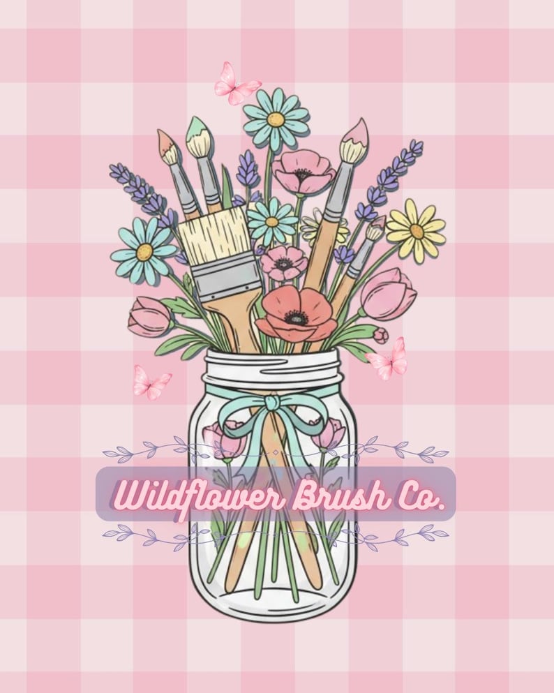 May include: A glass mason jar filled with paintbrushes and colorful wildflowers including daisies, poppies, and lavender. A light blue ribbon is tied around the jar neck. The text Wildflower Brush Co. is centered over the jar on a pink gingham background.