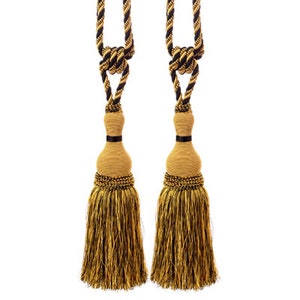May include: Two gold and black tassel tiebacks with a fringe design. The tassels are made of a woven fabric with a gold and black pattern.