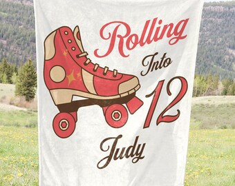 May include: White banner with a red and white roller skate graphic. The banner says "Rolling into 12 Judy".