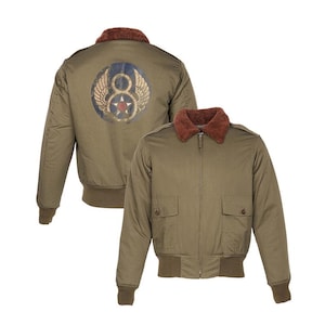 May include: Olive green bomber jacket with a brown faux fur collar and ribbed cuffs and hem. The back of the jacket features a circular emblem with wings, the number 8, and a star.