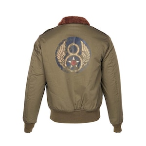 May include: Olive green bomber jacket with a brown faux fur collar and ribbed hem and cuffs. The back features a circular emblem with wings, the number 8, and a red star. A classic style jacket.