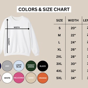 May include: Size chart for a sweatshirt with measurements in inches. The chart shows the width and length of the sweatshirt in different sizes, from S to 5XL. The sweatshirt is available in a variety of colors, including navy, ash, light blue, forest green, black, light pink, white, heliconia, sand, and orange.