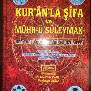 May include: A red book cover with the title "KUR'ÂN'LA ŞİFA ve MÜHR-Ü SÜLEYMAN" in gold lettering. The book is about solutions to all kinds of magic and sorcery. The book is published by Esma Yayınları, Mustafa Hoca Kitabevi.