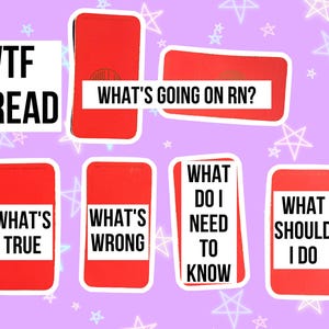 May include: A collection of red cards with white text on a lavender background with star illustrations. The cards display phrases like "WTF SPREAD", "WHAT'S GOING ON RN?", "WHAT'S TRUE", "WHAT'S WRONG", "WHAT DO I NEED TO KNOW", and "WHAT SHOULD I DO".