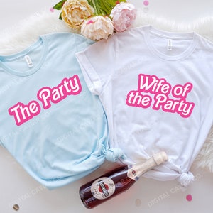 May include: Two white t-shirts with pink text. One shirt says "The Party" and the other says "Wife of the Party".