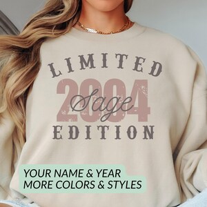 Personalized genderneutral  “Limited Edition” sweatshirt featuring a western-style design with customizable name and birth year. The beige crewneck in the image shows the text “LIMITED EDITION” in bold vintage lettering. Perfect for birthdays, anniversaries, or milestone gifts. Cozy unisex fit, available in multiple colors and styles. A trendy, aesthetic pullover for celebrating your birth year in a fun, unique way. A trendy custom genderneutral sweatshirt and birthday gift.