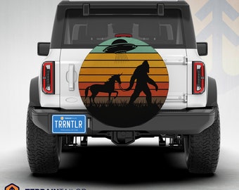 Retro Sunset Bigfoot & Unicorn Adventure Tire Cover fits Jeeps, Broncos, SUVs, Campers, RVs | Free US Shipping | No Backup Camera Option