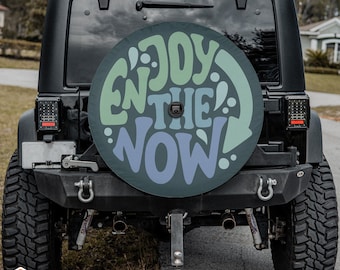 Enjoy The Now Whimsical Spare Tire Cover fits Jeeps, Broncos, SUVs, Campers | Free US Shipping | Includes Backup Camera Cutout