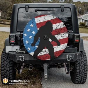 Bigfoot & Distressed American Flag Tire Cover fits Jeeps, Broncos, SUVs, Campers | Free US Shipping | Includes Backup Camera Cutout