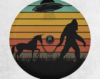Retro Sunset Bigfoot & Unicorn Adventure: UFO-Sighting Jeep, Bronco, SUV, Camper Tire Cover - With Backup Camera Cutout