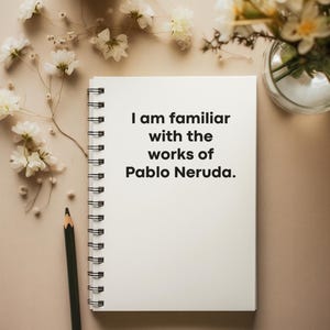 May include: A white notebook with a spiral binding and the text "I am familiar with the works of Pablo Neruda." written in black on the front. A pencil is lying next to the notebook on a beige surface.