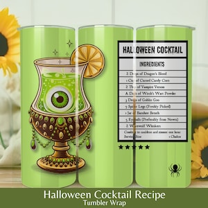 May include: A green tumbler wrap with a Halloween cocktail recipe. The design features a goblet with an eyeball inside and a lemon slice. The recipe includes ingredients like dragon's blood, cursed candy corn, and vampire venom. The text reads "Halloween Cocktail Recipe".