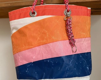 Upcycled striped sailbag made from vintage Woods Hole sail.