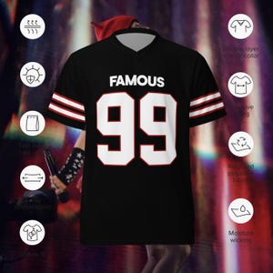 May include: Black jersey-style shirt with white "FAMOUS" text and the number "99" in white with red trim. Features a V-neck collar and red and white stripes on the sleeves. Made of recycled polyester fabric.