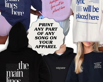 May include: Assortment of apparel, including t-shirts and hoodies, in navy, pink, black, and white. Each item features song lyrics or a design. The text "PRINT ANY PART OF ANY SONG ON YOUR APPAREL" is also visible.