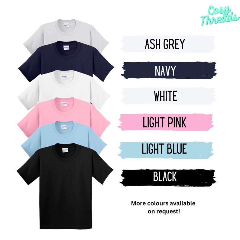 May include: A selection of t-shirts in a range of colours, including ash grey, navy, white, light pink, light blue, and black. The shirts are shown against a white background with the text "Cosy Threads" and "More colours available on request!"