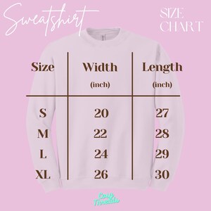 May include: White sweatshirt with a size chart. The chart displays measurements in inches for width and length, ranging from size small to extra-large. The width measurements are 20, 22, 24, and 26 inches. The length measurements are 27, 28, 29, and 30 inches.
