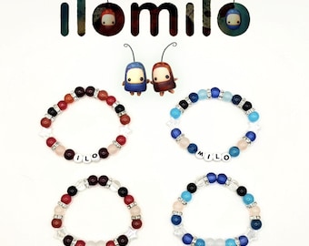 May include: Four beaded bracelets with the name "MILO" spelled out in white letter beads. The bracelets feature a mix of red, black, white, and blue beads. The image also includes the "ilomilo" logo and two small character figures.
