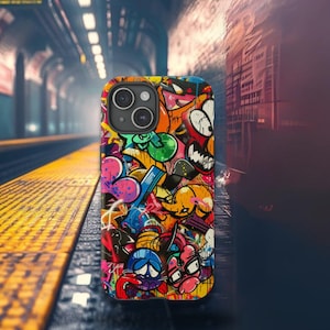 May include: A colorful phone case featuring a vibrant graffiti art design. The case showcases a mix of cartoon characters, abstract shapes, and bold lettering in a variety of colors, including red, blue, yellow, and green. The case is designed for a smartphone.