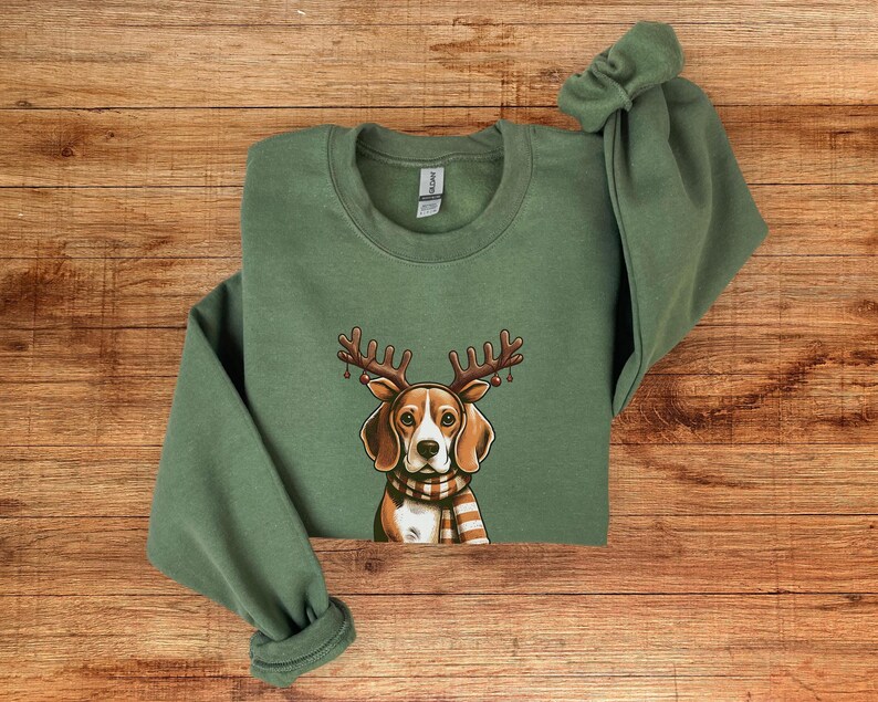 May include: Green Christmas sweatshirt with a beagle dog wearing reindeer antlers and a red and white plaid scarf.