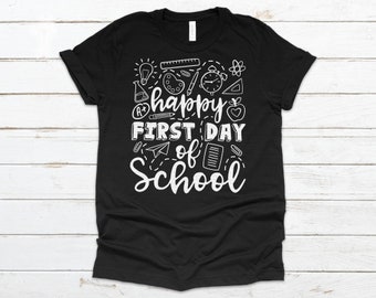May include: Black t-shirt with white text that reads "Happy First Day of School" and is surrounded by school-themed icons.